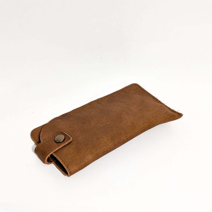 Leather Eyeglass Case in brown color, featuring a snap closure and soft texture for protecting glasses.