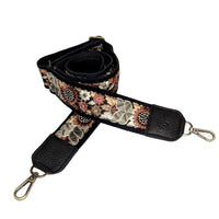 Floral patterned guitar purse strap with black leather accents