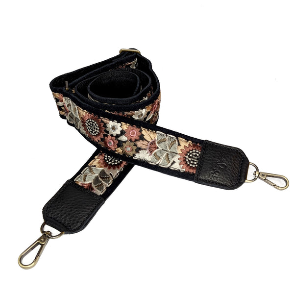 Lizzy Guitar Bag Strap featuring black sunflower and leather trim, a stylish accessory for any guitar bag.