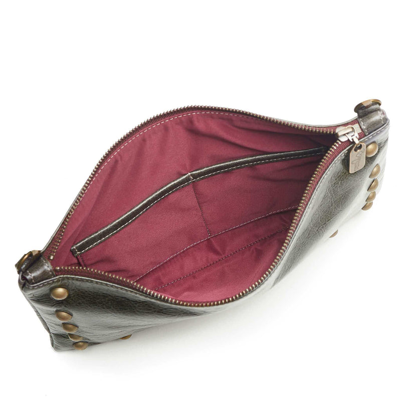 Interior of studded bag in dark charcoal full-grain leather small crossbody bag with detachable strap