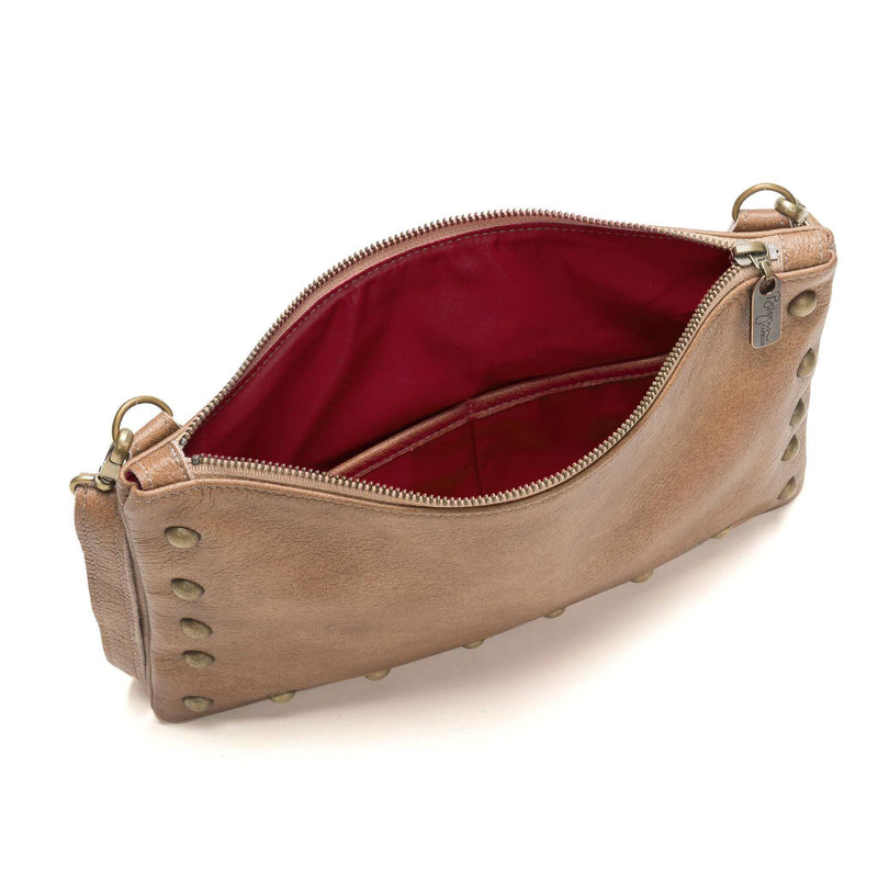 Interior of studded bag in golden tan full-grain leather small crossbody bag with detachable strap