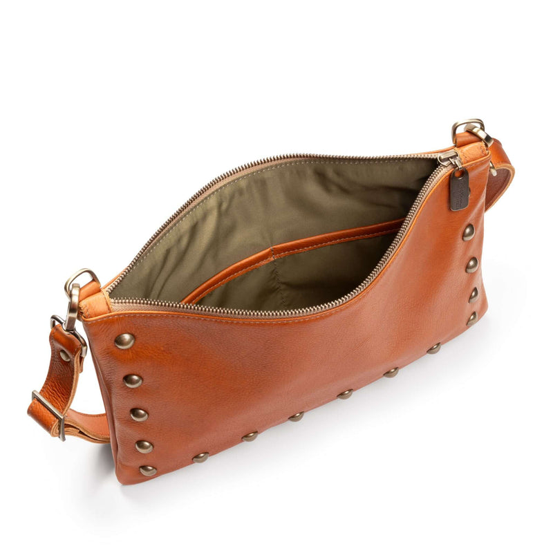 Interior of studded bag in rust full-grain leather, small crossbody bag showing lining and pockets