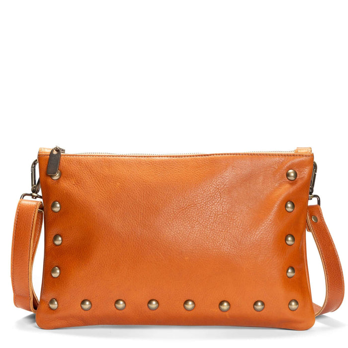 Studded bag in rust full-grain leather convertible clutch-to-crossbody with adjustable strap