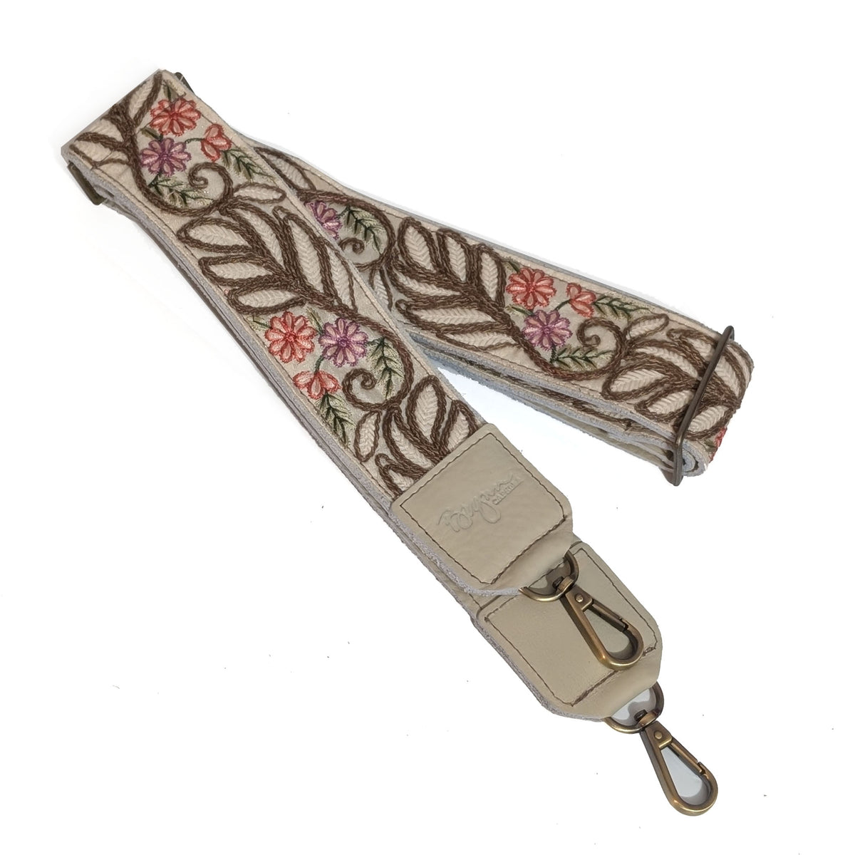 Floral embroidered strap with a metal clasp on a white background