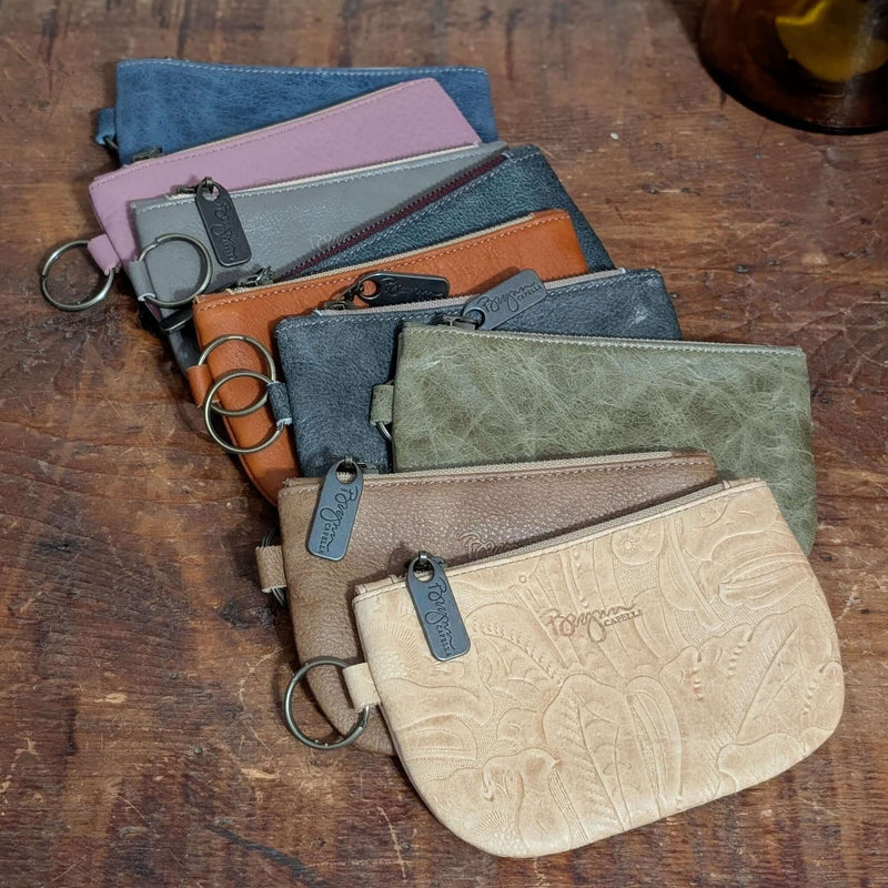 Collection of Dylan Coin Bags in various colors, showcasing leather coin purses with upgraded zippers.
