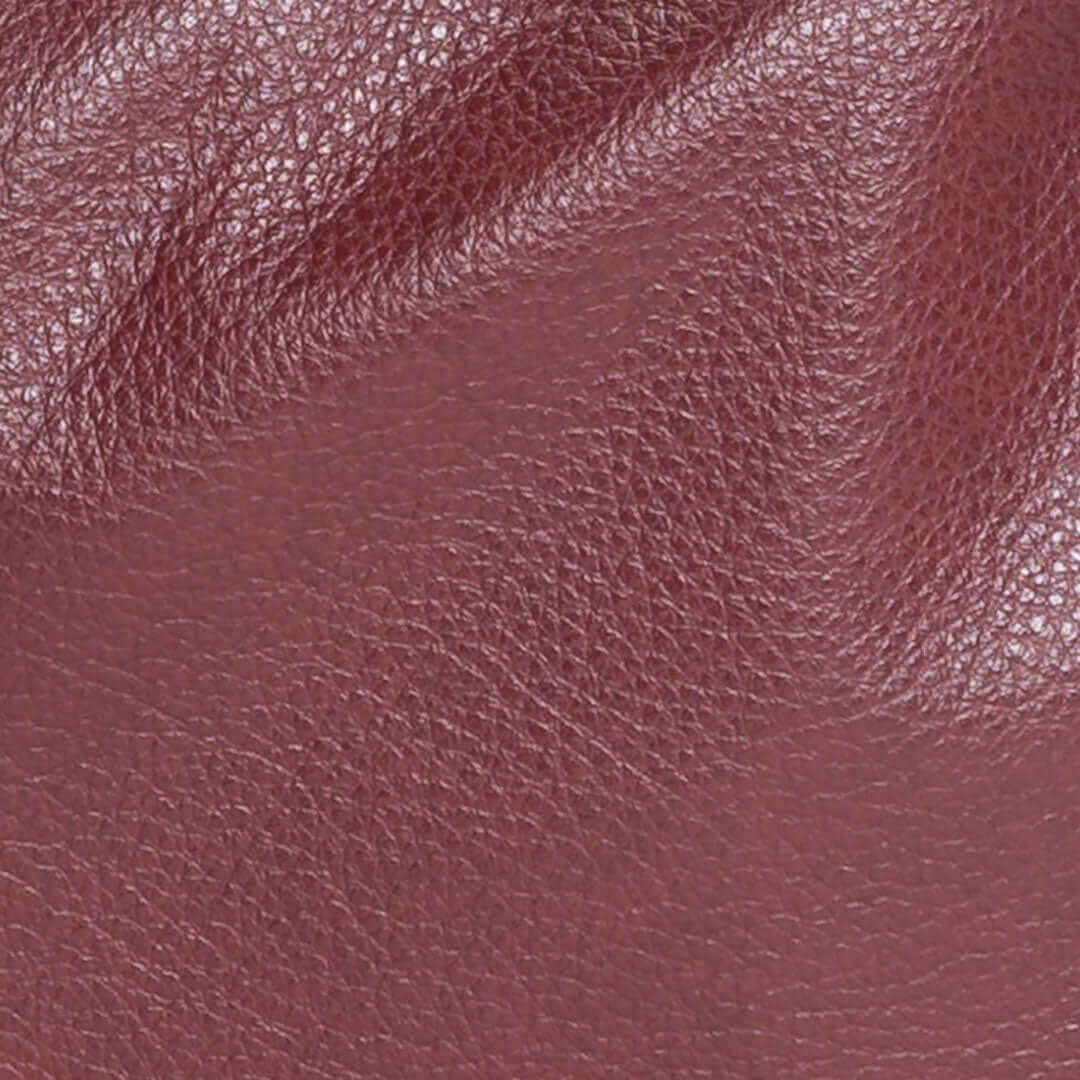 Close-up of Free Love, a semi-aniline full grain leather in plum