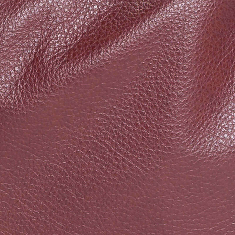 Close-up of Free Love, a semi-aniline full grain leather in plum