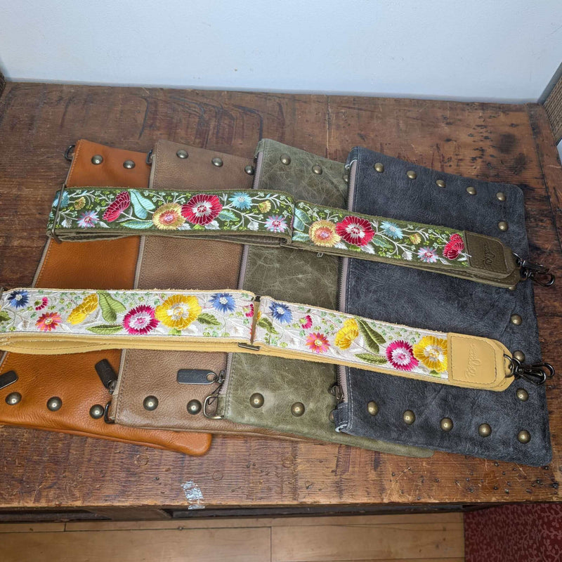 Lizzy Guitar Bag Strap - Evergreen Wildflowers on leather handbags, showcasing guitar purse strap with colorful floral design.