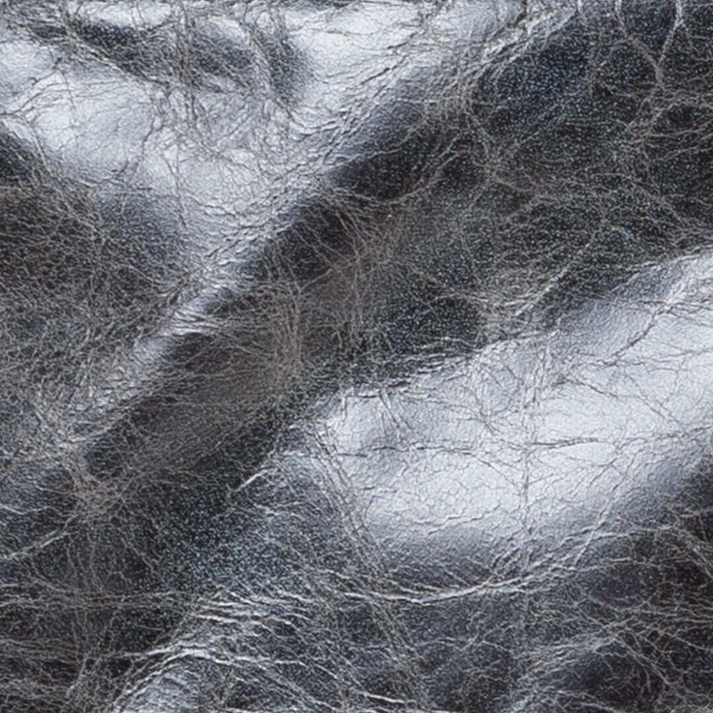 Close-up of river rock leather texture for leather crossbody bags, showcasing its unique shine and quality.