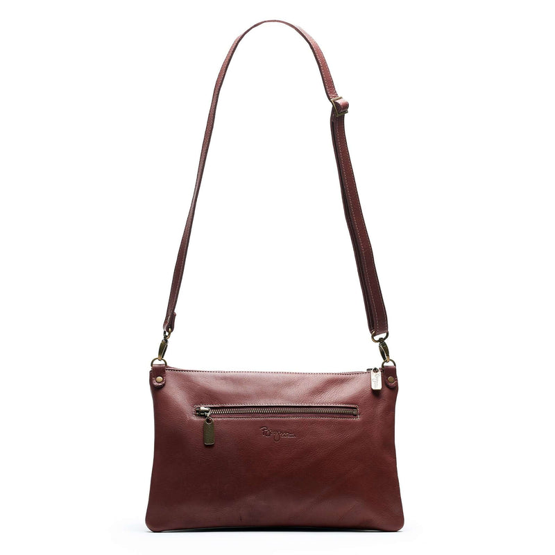 Back view of Studded bag in wine full-grain leather convertible clutch-to-crossbody with detachable strap