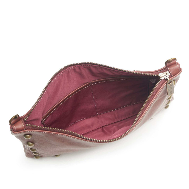 Interior of studded bag in wine full-grain leather, small crossbody bag showing lining and pockets