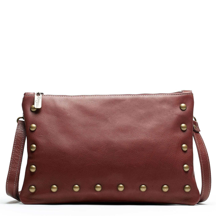 Studded bag in wine full-grain leather convertible clutch-to-crossbody with adjustable strap