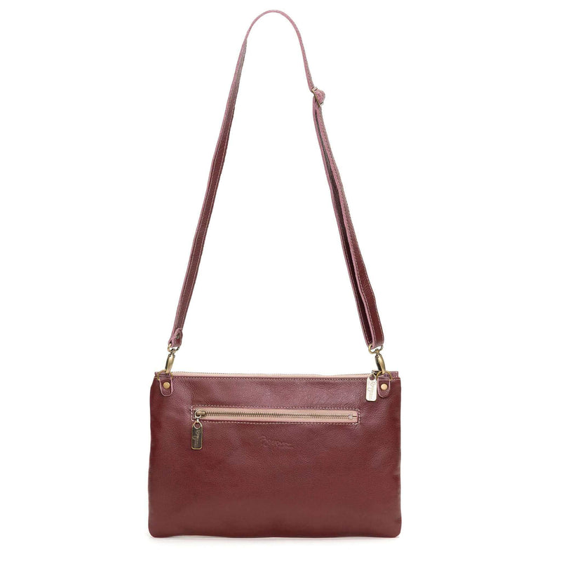 Back view of Studded bag in plum full-grain leather convertible clutch-to-crossbody with detachable strap