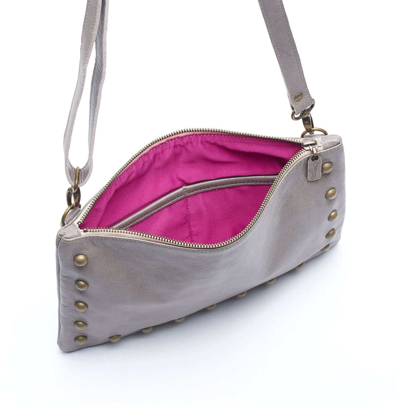 Interior of studded bag in light grey full-grain leather small crossbody bag with detachable strap